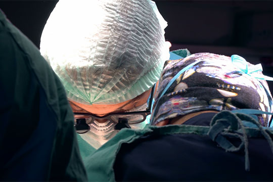 Surgeon performing heart surgery